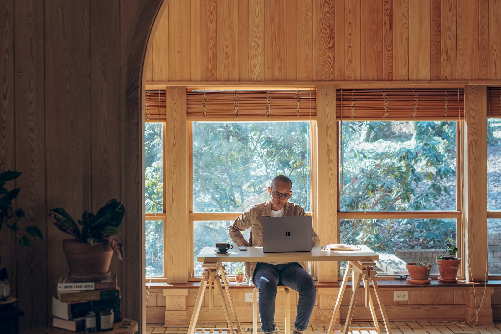 person sitting on chair using a Surface device